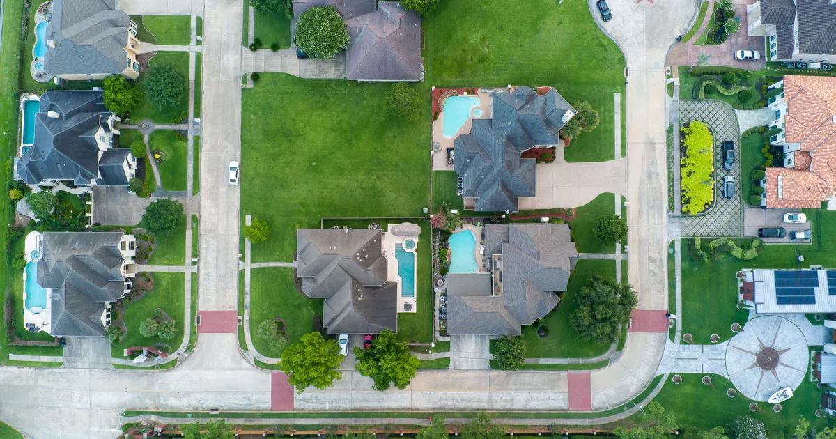 Aerial view of Australian suburban housing blocks, showing the land and boundaries that carry site risk