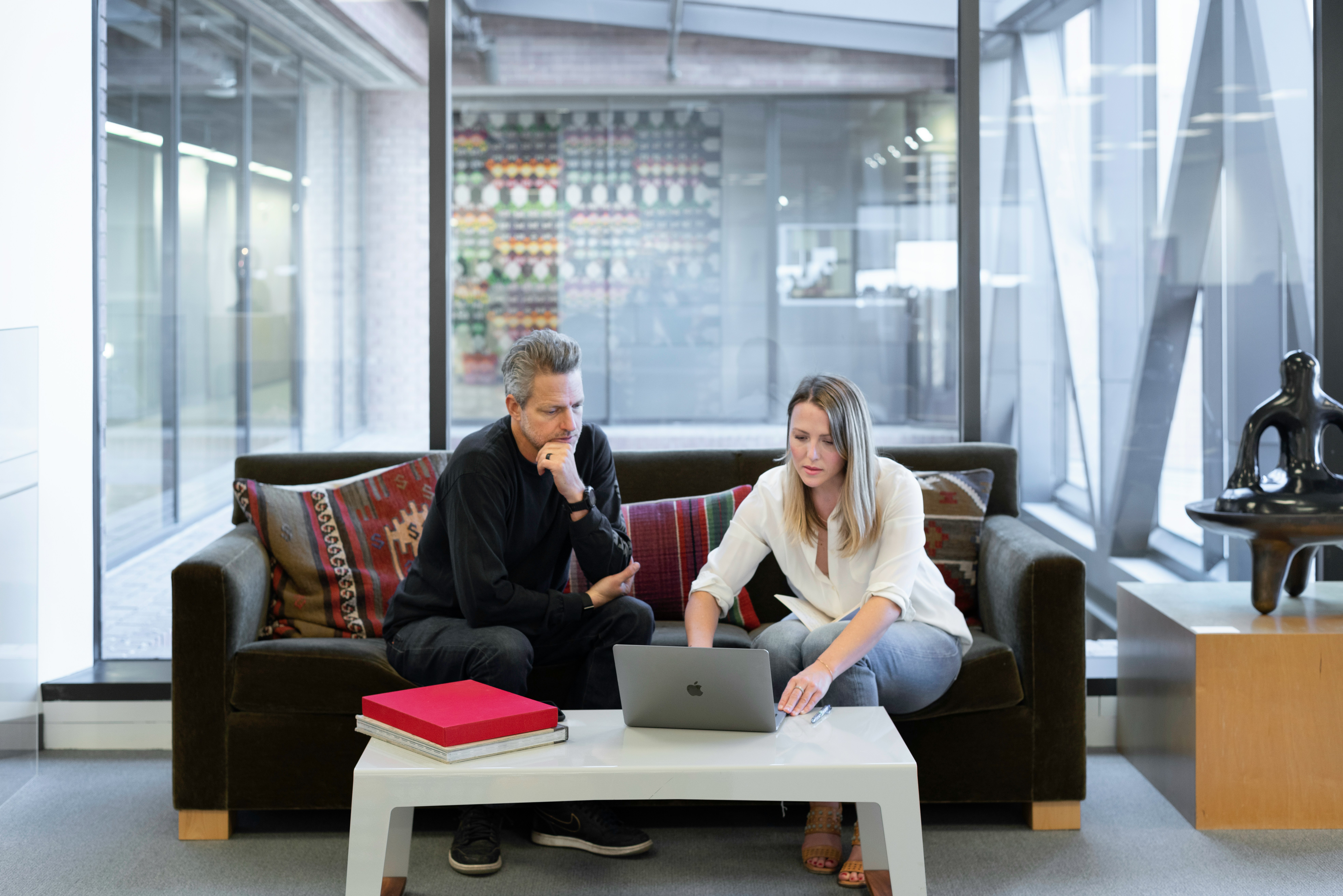 Home buyers reviewing property options with a real estate agent after a house inspection in Australia